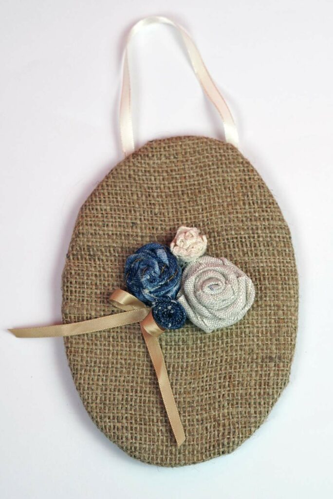 Art mural rose en toile de jute