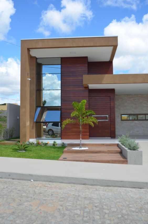 Idées conseils pour faire une façade de maison MODERNE Façade de lignes droites avec bois et verre bronze réfléchissant 